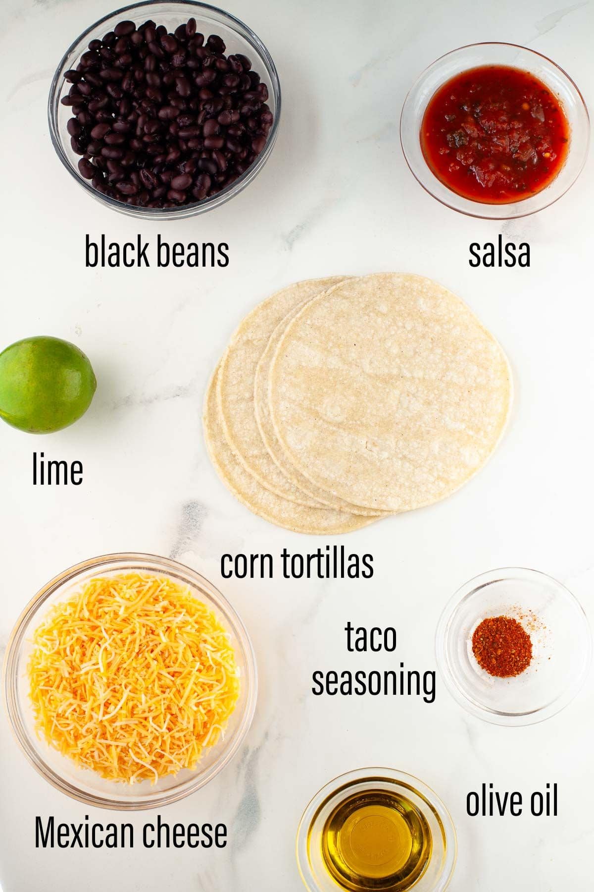 graphic of ingredients for crispy black bean tacos on white marble surface with black text overlay